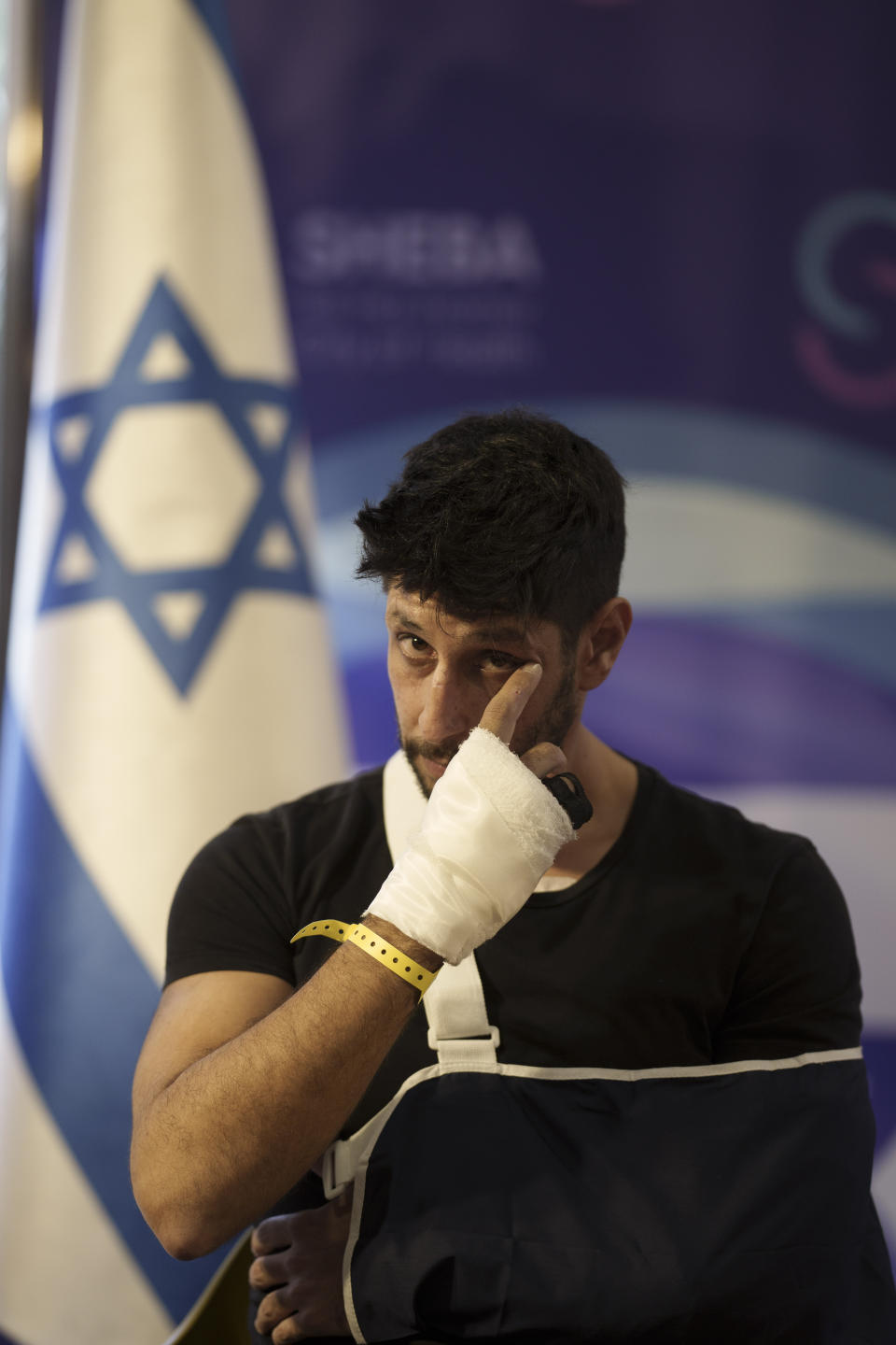 The actor Idan Amedi, well known for his role in the Netflix series "Fauda", attends a press conference at the Sheba Medical Center in Ramat Gan, Israel, Thursday, Jan. 25, 2024, after been released from the hospital where he was treated from his injuries after being wounded while fighting in the Gaza Strip. (AP Photo/Leo Correa)