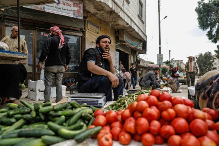 A general view taken on April 26, 2018, shows a man selling vegetables in the northern Syrian enclave of Afrin that Ankara-backed forces captured from Kurdish fighters in recent months