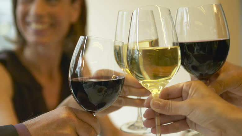 Group toasting wine glasses