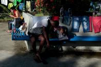 A Cuban migrant rests on his bags as he waits for the opening of the border between Costa Rica and Nicaragua in Penas Blancas, Costa Rica November 17, 2015. More than a thousand Cuban migrants hoping to make it to the United States were stranded in the border town of Penas Blancas, Costa Rica, on Monday after Nicaragua closed its border on November 15, 2015 stoking diplomatic tensions over a growing wave of migrants making the journey north from the Caribbean island. REUTERS/Oswaldo Rivas