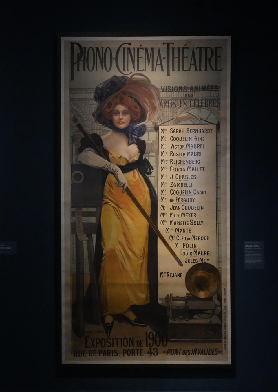 A poster for the representation of "Animated views of famous artists" for the Phono-Cinema-Theatre, lithoraphy in color by Francois Flameng, 1900, is exhibited at the "Sarah Bernhardt, and the woman created the star" exhibition at the Petit Palais museum in Paris, Friday, April 28, 2023. Bernhardt was one of the world’s most famous women by the time of her death in 1923. Inside Paris’ Petit Palais museum, the public is now discovering the madcap jigsaw puzzle of gothic stories, costumes, recordings, films, photos, jewels, sculptures, and personal objects for the first time together that made the unclassical beauty the object of fascination from Berlin, to London and New York. (AP Photo/Michel Euler)