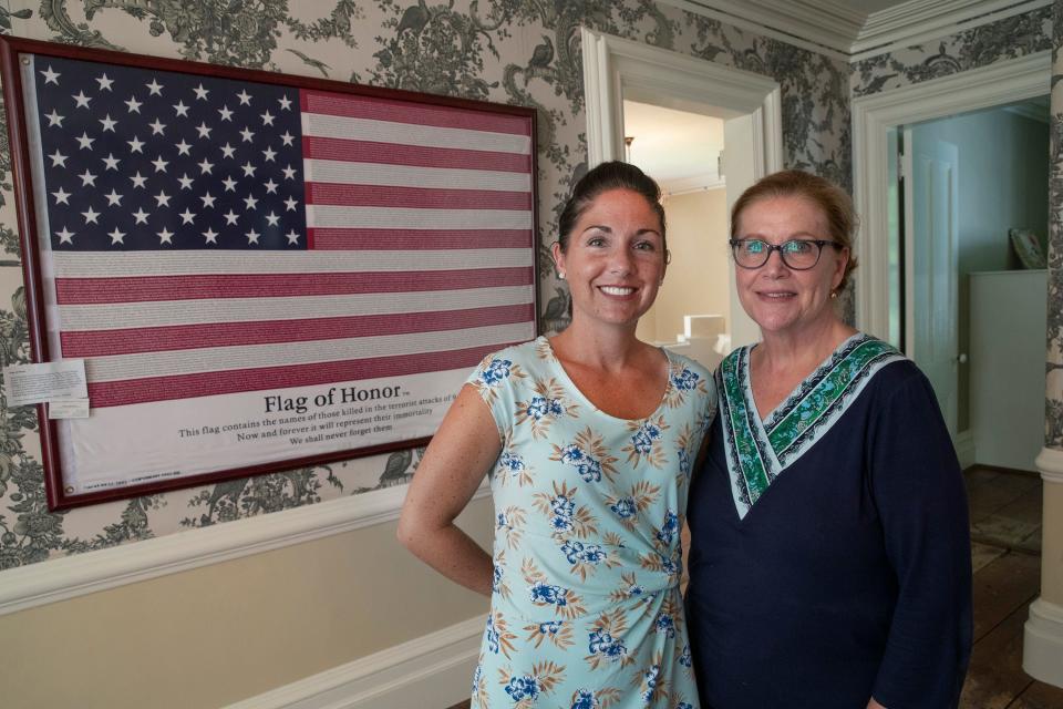 Monmouth County Historical Association President Linda Bricker (right) with Monmouth University History Professor Melissa Ziobro at a 9/11 exhibit at the Taylor-Butler House in Middletown