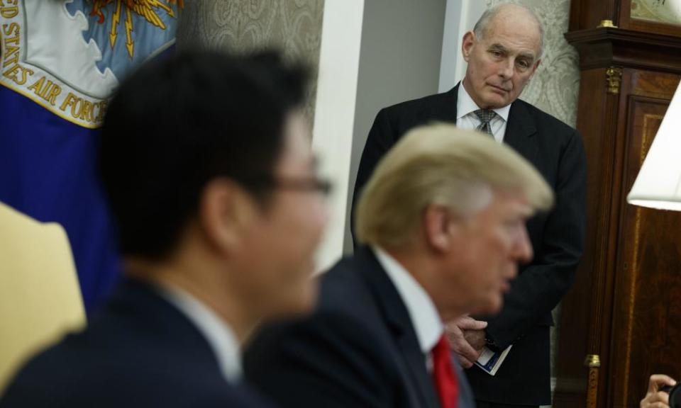John Kelly listens during a meeting in the Oval Office of the White House in Washington on Friday.