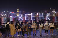 People form a human chain in support of protest movement in the harbor area in Hong Kong, Monday, Sept. 30, 2019. Hong Kong police warned Monday of the potential for protesters in the semi-autonomous Chinese territory to engage in violence "one step closer to terrorism" during this week's National Day events, an assertion ridiculed by activists as propaganda meant to scare people from taking to the streets. (AP Photo/Vincent Thian)