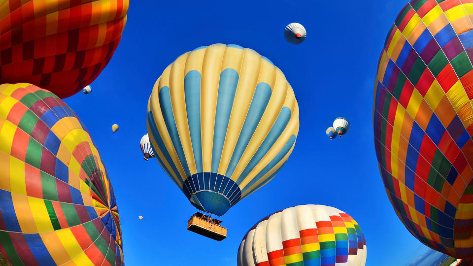 Air Vehicle, Colorful hot air balloons against blue sky - Stock imageHot Air, Mode of Transport, Summer, sunset