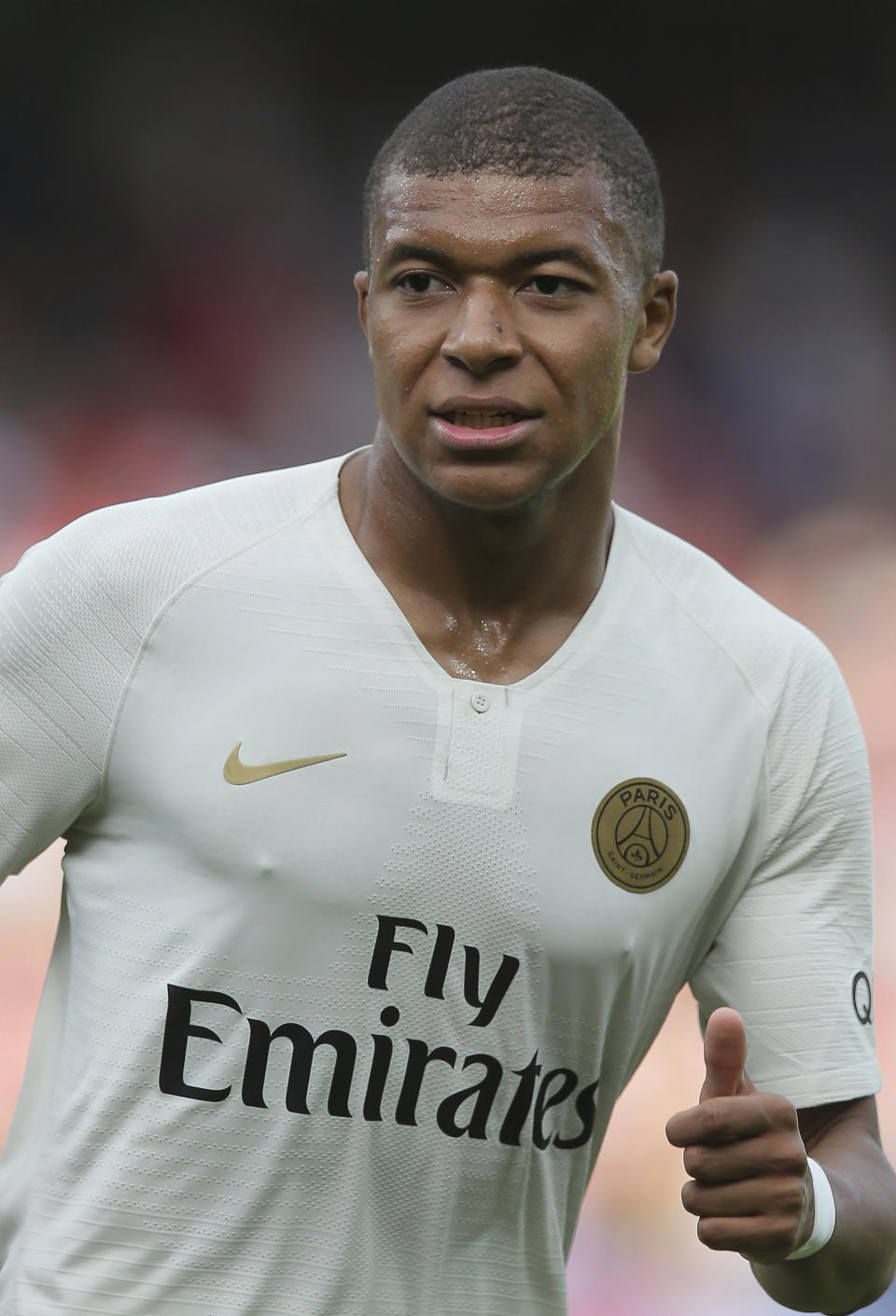 PSG's Kylian Mbappe gives the thumb-up sign during their League One soccer match between Guingamp and Paris Saint Germain at Roudourou stadium in Guingamp, western France, Saturday, Aug. 18, 2018. (AP Photo)