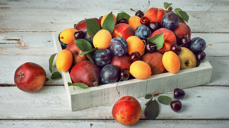 Box of orchard and stone fruits