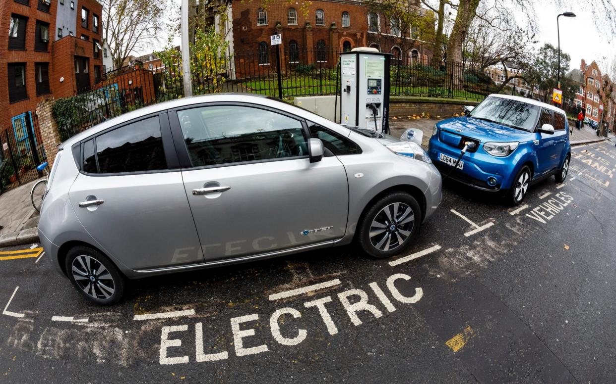 Go Ultra Low Nissan LEAF (L) and Kia Soul EV (R) on charge on a London street. Ultra-low emission vehicles such as this can cost as little as 2p per mile to run and some electric cars and vans have a range of up to 700 miles. -  Getty Images Europe