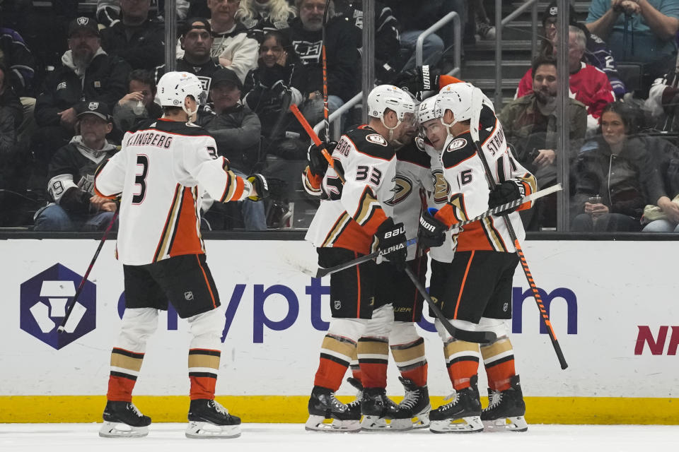 Anaheim Ducks right wing Frank Vatrano (77) celebrates with teammates after scoring during the second period of an NHL hockey game against the Los Angeles Kings Tuesday, Dec. 20, 2022, in Los Angeles. (AP Photo/Ashley Landis)