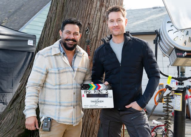 <p>Michael Courtney/CBS</p> Director Jon Huertas and Justin Hartley behind the scenes of Tracker