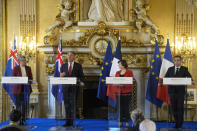 French Foreign Minister Catherine Colonna, second right, French Defense Minister Sebastien Lecornu, right, attend a joint press conference with Australian Defense Minister Richard Marles, second left, and Australian Foreign Minister Penny Wong, Monday, Jan. 30, 2023 in Paris. (AP Photo/Michel Euler)