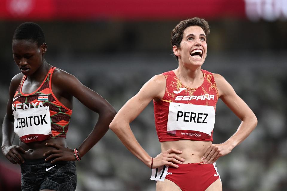 Spain's Marta Perez (R) and Kenya's Edinah Jebitok react after cmpeting in the women's 1500m semi-finals during the Tokyo 2020 Olympic Games at the Olympic Stadium in Tokyo on August 4, 2021. (Photo by Jewel SAMAD / AFP) (Photo by JEWEL SAMAD/AFP via Getty Images)