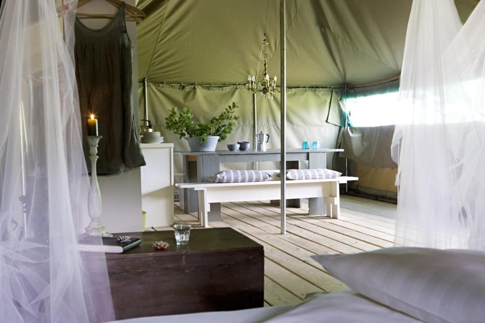 <p><span>Meadow pitches. a pristine pool and a cluster of glamping options await at </span><a rel="nofollow noopener" href="https://coolcamping.com/campsites/europe/france/west-france/aquitaine/365-la-parenthese-camping-les-ormes" target="_blank" data-ylk="slk:this campsite just south of Bergerac" class="link "><span>this campsite just south of Bergerac</span></a><span>. Safari tents are tastefully designed and furnished, while the boutique café in a converted barn is chic and modern. Want more? Play tennis on the onsite court or take a dip in the private lake. A tent and two people from €18 (£15). [Photo: Cool Camping]</span> </p>