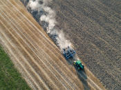 <p>A farmer prepares a wheat field for the next sowing on Aug. 6, 2018 in Biebesheim near Darmstadt, Germany. Farmers are fighting against the long-lasting drought and heat as they are unable to irrigate their fields on a large scale, which is resulting in large crop failures and income for them. (Photo: Thomas Lohnes/Getty Images) </p>