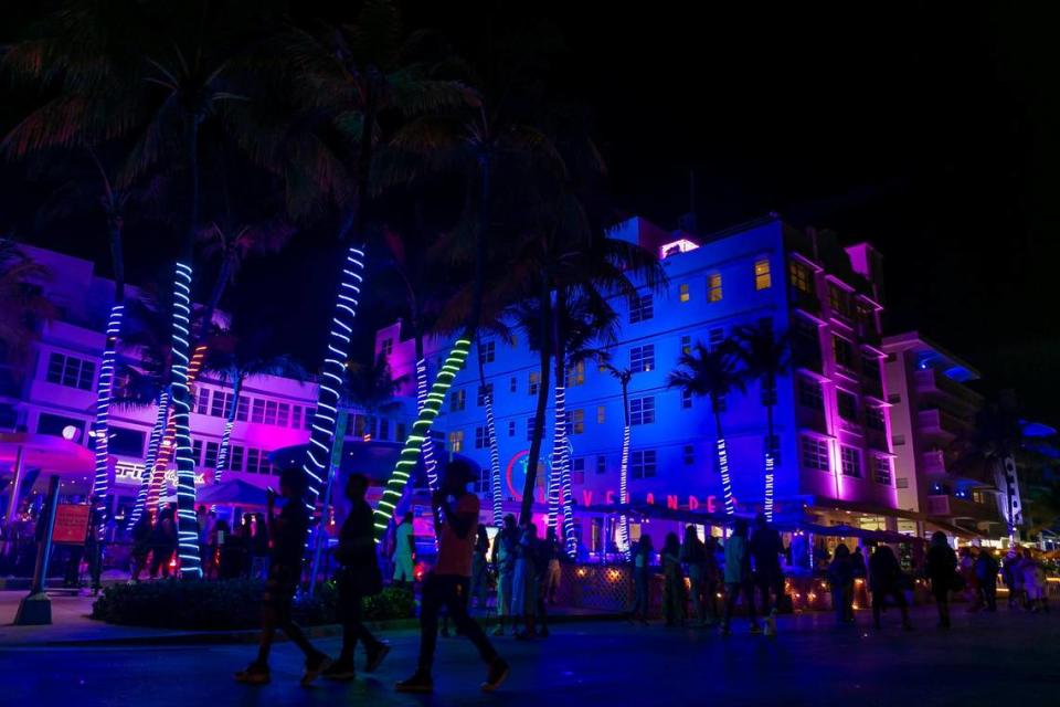 South Beach visitors walk down Ocean Drive near the Clevelander in Miami Beach during the start of Memorial Day Weekend on Friday, May 28, 2021.