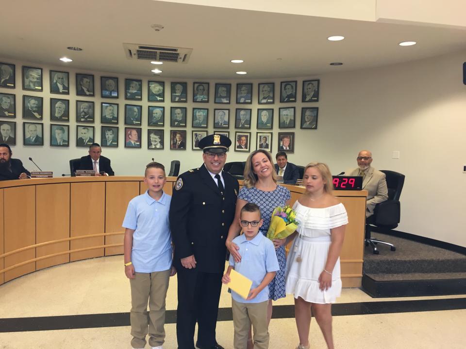 Ramapo Police Capt. Daniel Hyamn, his wife, Sgt.  Margaret Sammorone and her three children at Hyman's promoted during a ceremony at City Hall on July 11, 2019