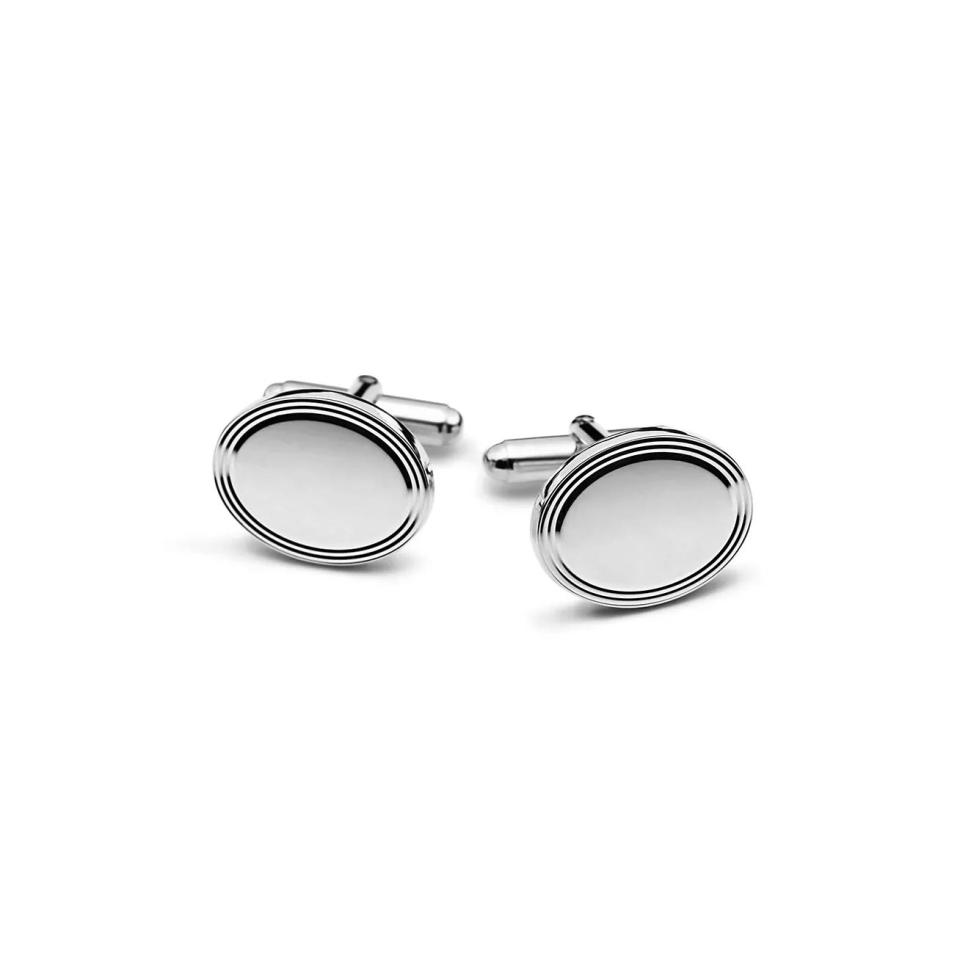 <p><a href="https://www.tiffany.com/accessories/cuff-links/engine-turned-oval-cuff-links-13181446/" rel="nofollow noopener" target="_blank" data-ylk="slk:Shop Now;elm:context_link;itc:0;sec:content-canvas" class="link ">Shop Now</a></p><p>Engine-Turned Oval Cuff Links</p><p>$400.00</p><p>tiffany.com</p>
