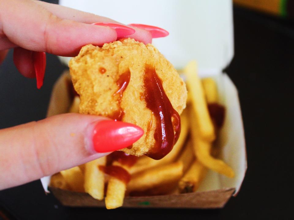 mcdonalds chicken nuggets and fries covered in bbq sauce