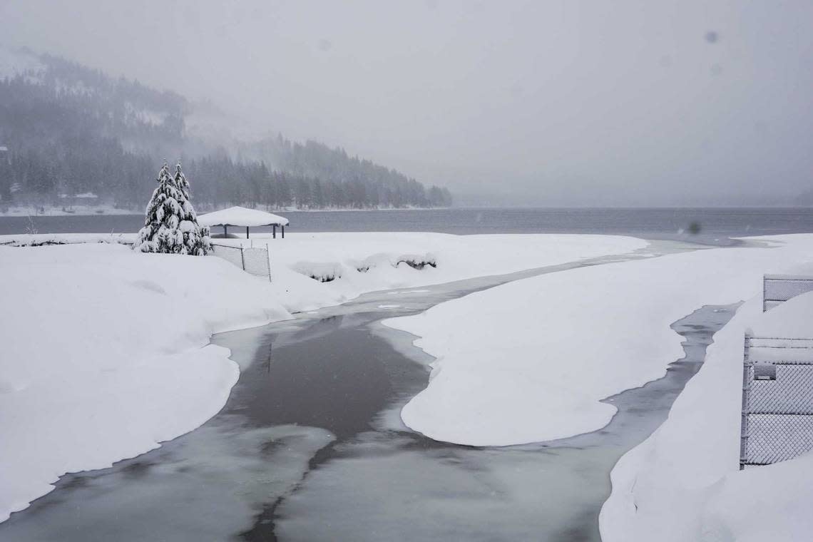 Snow covers the shore on Donner Lake, Saturday, March 2, 2024, in Truckee, Calif. A powerful blizzard howled Saturday in the Sierra Nevada as the biggest storm of the season shut down a long stretch of Interstate 80 in California and gusty winds and heavy rain hit lower elevations, leaving tens of thousands of homes without power. Brooke Hess-Homeier/AP