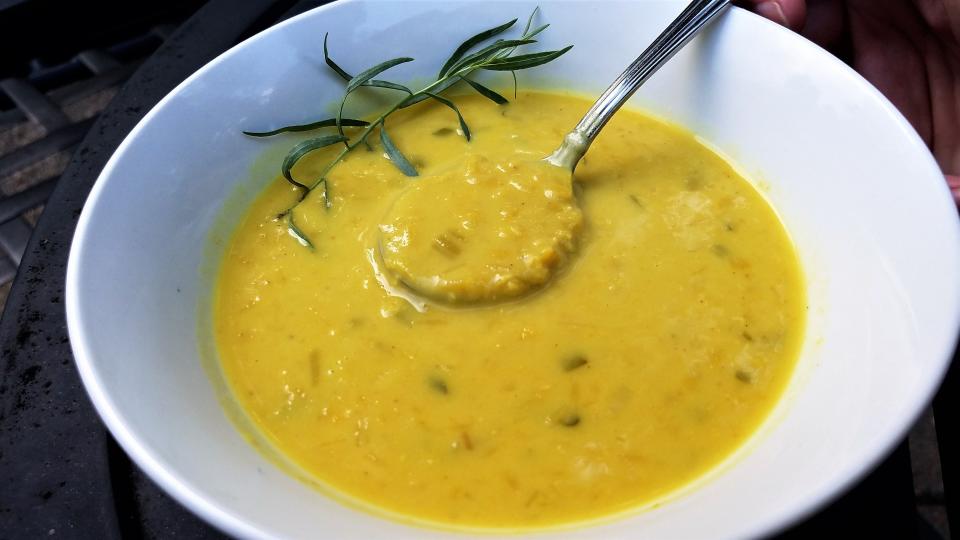 A Massachusetts woman was accused of trying to poison her husband's soup, at the direction of a man posing as a soap opera star, police said. This file photo shows a bowl of carrot and lentil soup.