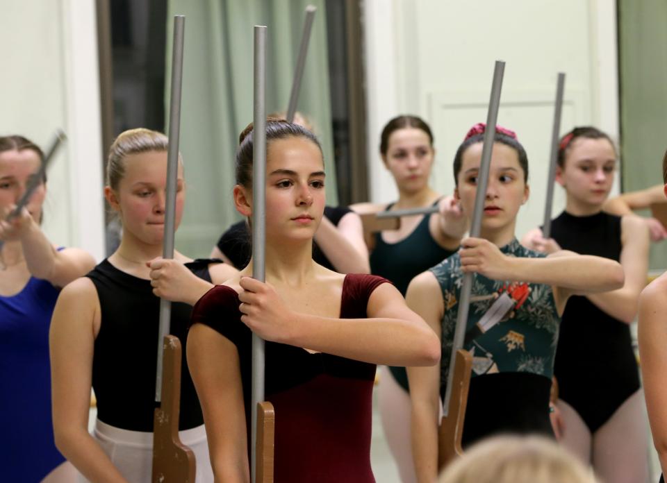 Sydney Ritschard, center, joins other dancers to rehearse the battle scene Wednesday, Nov. 30, 2022, at Colfax Cultural Center for Southold Dance Company’s production of "The Nutcracker" that takes place Dec. 9 to 11 at the Morris Performing Arts Center in South Bend.