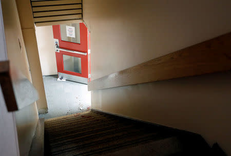 Blood is seen on the stairs of the Quebec Islamic Cultural Centre in Quebec City. REUTERS/Mathieu Belanger
