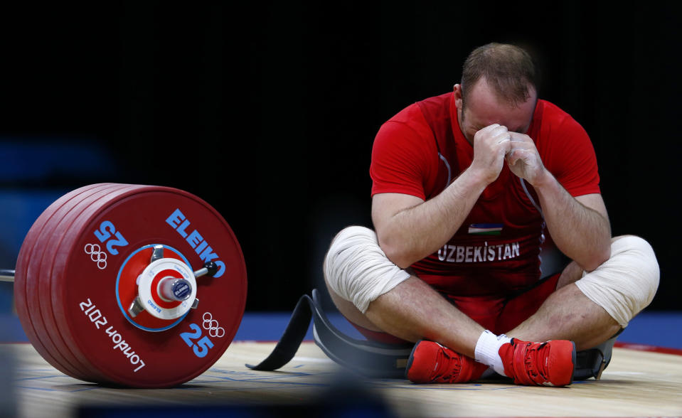 Uzbekistan's Ruslan Nurudinov reacts after failing a lift in the men's 105kg Group A weightlifting clean and jerk competition at the ExCel venue during the London 2012 Olympic Games August 6, 2012. REUTERS/Grigory Dukor (BRITAIN - Tags: OLYMPICS SPORT WEIGHTLIFTING) 