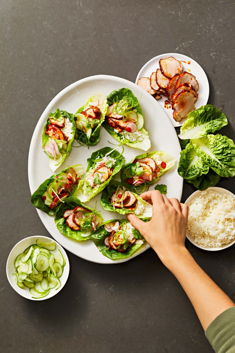 <p>Gochujang adds impressive heat to juicy pork tenderloin. Cool it down with crisp lettuce and cooked rice.</p><p>Get the <strong><a href="https://www.goodhousekeeping.com/food-recipes/a38538435/pork-lettuce-wraps-recipe/" rel="nofollow noopener" target="_blank" data-ylk="slk:Fiery Pork Lettuce Wraps recipe" class="link ">Fiery Pork Lettuce Wraps recipe</a></strong>. </p>
