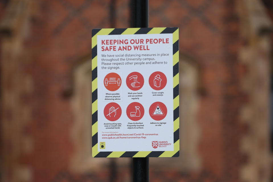 A sign outside Queen's University in Belfast. Stormont finance minister Mr Murphy said there was a need to confirm what level of support the UK Government would offer if another lockdown was required. (Photo by Liam McBurney/PA Images via Getty Images)