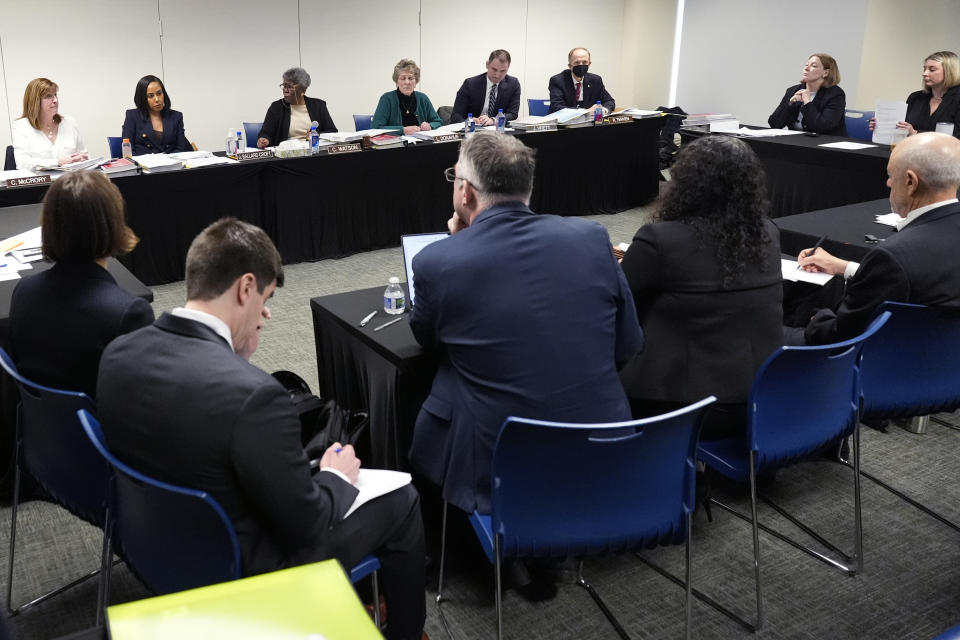 People attend the Illinois State Board of Elections meeting in Chicago, Tuesday, Jan. 30, 2024. Illinois’ election board kept former President Donald Trump on the state’s primary ballot, a week before the U.S. Supreme Court hears arguments on whether the Republican’s role in the Jan. 6, 2021, attack on the U.S. Capitol disqualifies him from the presidency. (AP Photo/Nam Y. Huh)