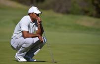 Feb 16, 2018; Pacific Palisades, CA, USA; Tiger Woods lines up a putt on the fourth green during the second round of the Genesis Open golf tournament at Riviera Country Club. Mandatory Credit: Orlando Ramirez-USA TODAY Sports