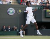 Gael Monfils of France hits a shot during his match against Gilles Simon of France at the Wimbledon Tennis Championships in London, July 4, 2015. REUTERS/Stefan Wermuth