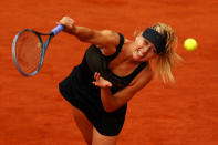 PARIS, FRANCE - JUNE 09: Maria Sharapova of Russia serves in the women's singles final against Sara Errani of Italy during day 14 of the French Open at Roland Garros on June 9, 2012 in Paris, France. (Photo by Clive Brunskill/Getty Images)