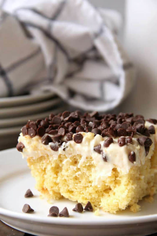 <p><strong>Cannoli Poke Cake</strong></p><p>Get the recipe <a href="https://snappygourmet.com/cannoli-poke-cake/" rel="nofollow noopener" target="_blank" data-ylk="slk:here;elm:context_link;itc:0;sec:content-canvas" class="link rapid-noclick-resp"><em><strong>here</strong></em></a></p>