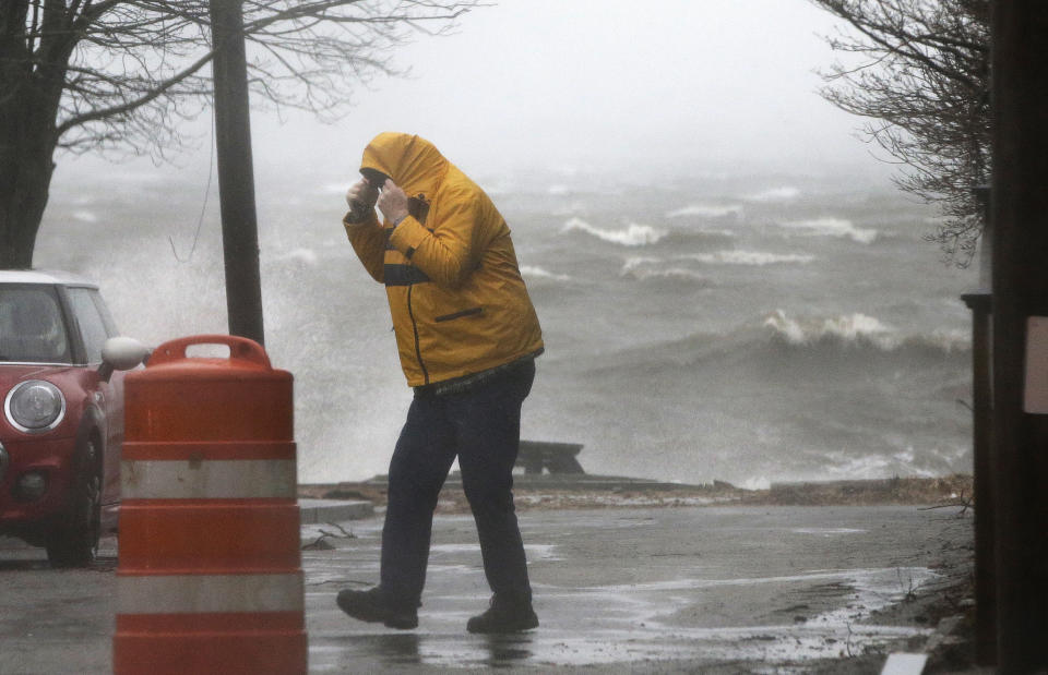 <p>A pedestrian walks near the coastline Friday, March 2, 2018, in Newburyport, Mass. as a major nor’easter pounds the East Coast, packing heavy rain, intermittent snow and strong winds. (Photo: Elise Amendola/AP) </p>