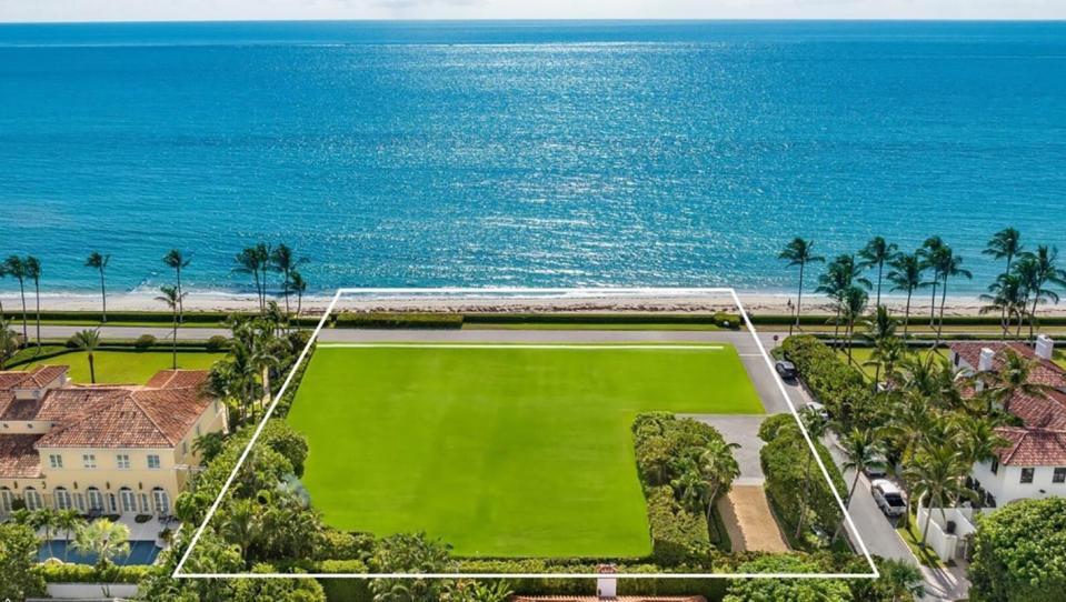 A digitally altered photo shows how an oceanfront property at 101 Jungle Road in Palm Beach might look if the house there were demolished and the land planted with grass. The property is priced at $54.9 million.