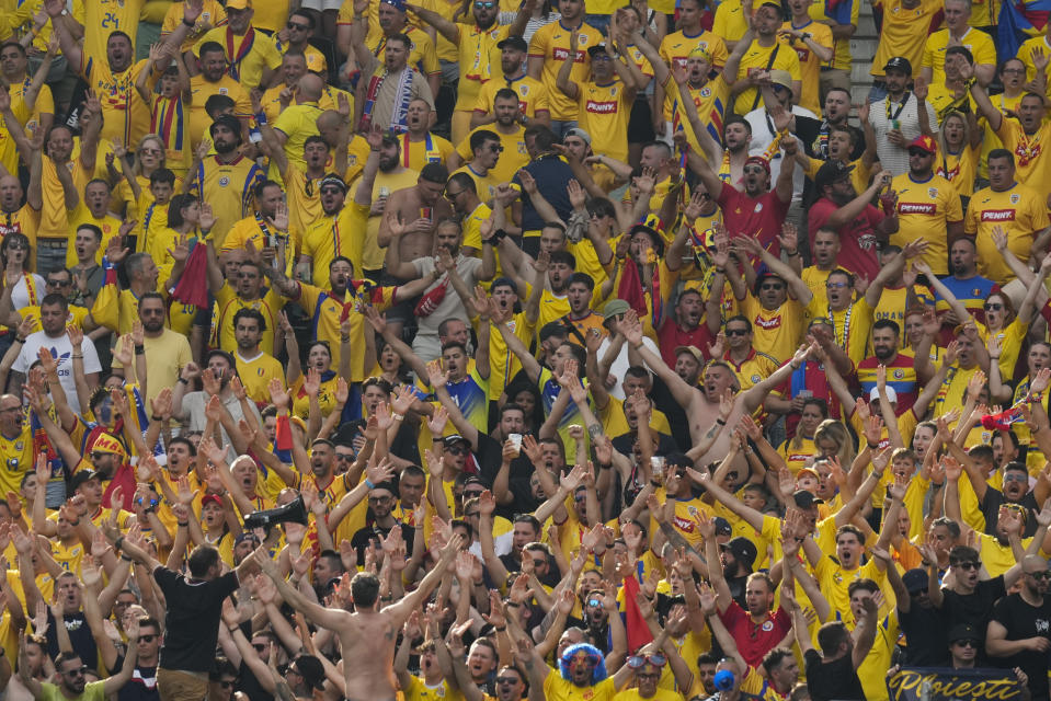 Romanian fans cheer during a Group E match against Slovakia at the Euro 2024 soccer tournament in Frankfurt, Germany, Wednesday, June 26, 2024. (AP Photo/Themba Hadebe)