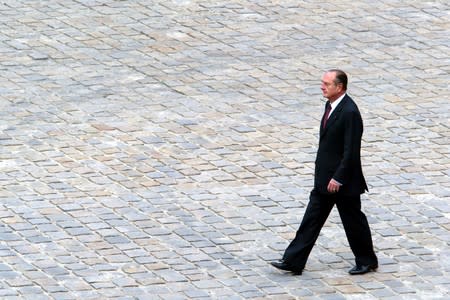 FILE PHOTO: Files photo of French President Jacques Chirac walking in the courtyard of the Invalides church during a ceremony in Paris