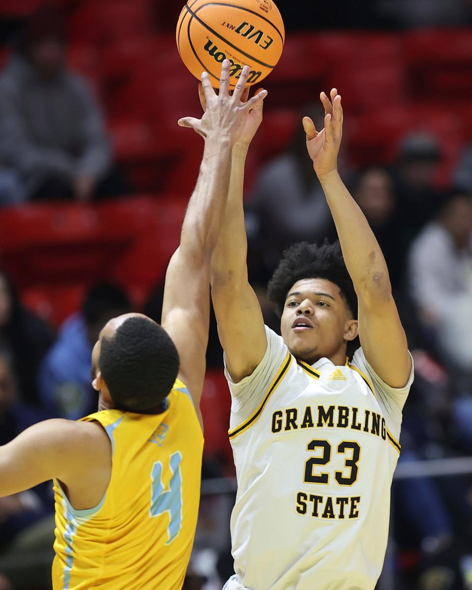 Grambling State guard Quintin Murrell (23) shoots over Southern guard Isaiah Rollins (4) during the NBA All-Star HBCU classic college basketball game Saturday, Feb. 18, 2023, in Salt Lake City. (AP Photo/Rob Gray)