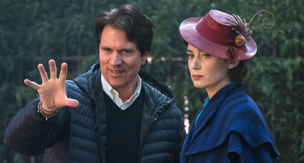 Emily Blunt receives instructions from director Rob Marshall on the set of <i>Mary Poppins Returns</i>. (Disney)