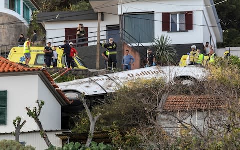 Emergency services inspect the scene of a tourist bus crash in Canico, Santa Cruz, Madeira Island, Portugal, 17 April 2019 - Credit: &nbsp;HOMEM GOUVEIA/REX