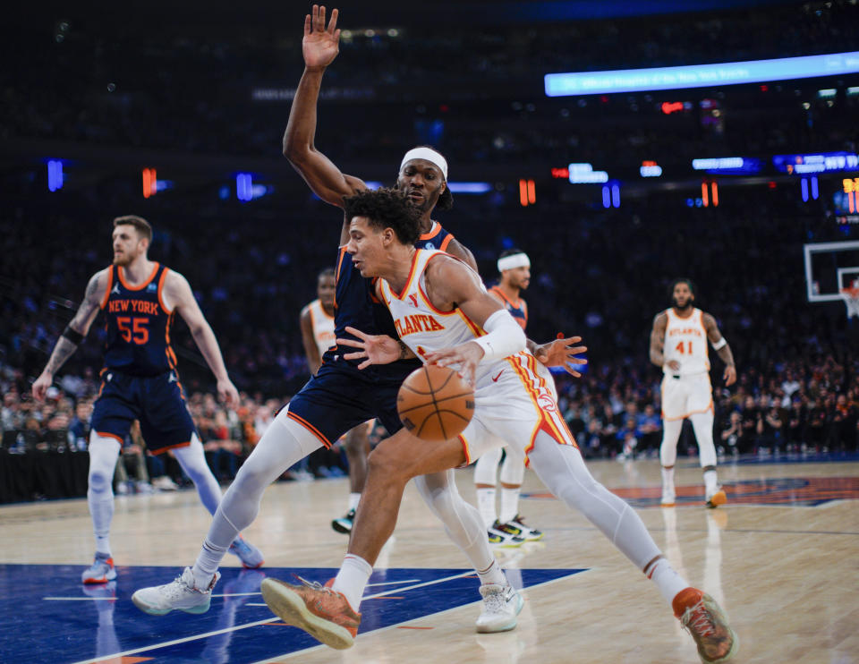 Atlanta Hawks forward Jalen Johnson drives against New York Knicks forward Precious Achiuwa during the first half of an NBA basketball game Tuesday, March 5, 2024, in New York. (AP Photo/Eduardo Munoz Alvarez)