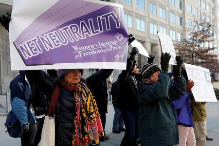FILE PHOTO - Net neutrality advocates rally in front of the Federal Communications Commission (FCC) ahead of Thursday's expected FCC vote repealing so-called net neutrality rules in Washington, U.S., December 13, 2017. REUTERS/Yuri Gripas