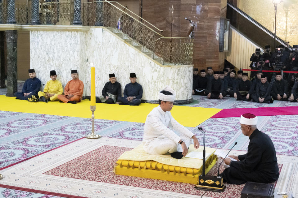 This handout picture taken by Brunei's Information Department on January 11, 2024 and released on January 12, 2024 shows Brunei's Prince Abdul Mateen sitting during his solemnization at Sultan Omar Ali Saifuddien Mosque in Bandar Seri Begawan, Brunei. (Brunei's Information Department via AP)