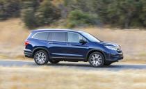 <p>More pronounced body cladding-that black-plastic stuff you see along the fenders and lower bumpers here-lend the 2019 Pilot a more rugged appearance. </p>