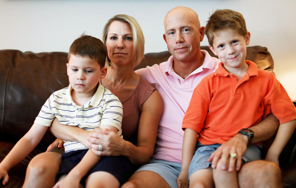 Col. John Cale Brown and Darlena Brown pose for a portrait with their sons J.C. and Rider at their home in 2017. Picture taken 2017. To match Special Report USA-MILITARY/HOUSING REUTERS/Aaron P. Bernstein