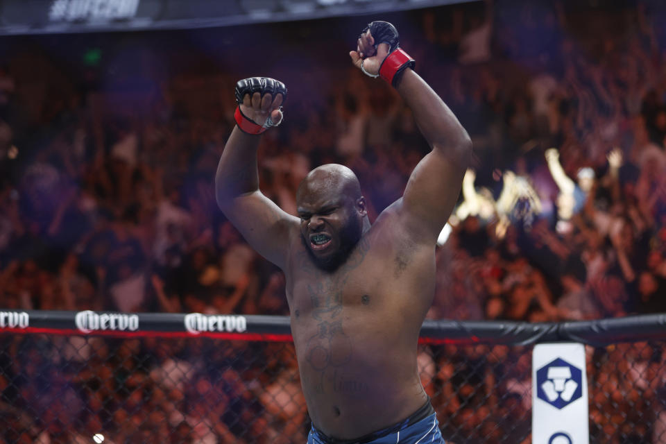 Jul 29, 2023; Salt Lake City, Utah, USA; Derrick Lewis (red gloves) reacts to defeating Marcos Rogerio De Lima (blue gloves) during UFC 291 at Delta Center. Mandatory Credit: Jeff Swinger-USA TODAY Sports