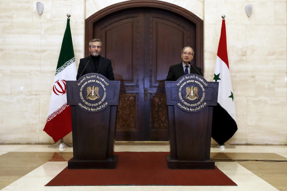 Syrian Foreign Minister Faisal Mekdad, right, speaks during a joint news conference with Iranian interim Foreign Minister Ali Bagheri Kani in Damascus, Syria, Tuesday, June 4, 2024. Mekdad said Tuesday that any dialogue between Syria and Turkey should be preceded by Ankara's announcement that it will withdraw its troops from all Syrian territories that it controls. (AP Photo/Omar Sanadiki)