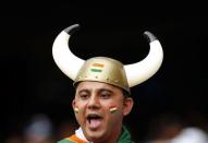 An Indian supporter reacts after India's Shikhar Dhawan reached his century during the Cricket World Cup match against South Africa at the Melbourne Cricket Ground (MCG) February 22, 2015. REUTERS/Brandon Malone