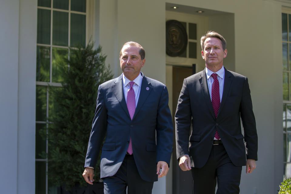 Health and Human Services Secretary Alex Azar, left, and acting FDA Commissioner Ned Sharpless arrive to speak with reporters after a meeting about vaping with President Donald Trump in the Oval Office of the White House, Wednesday, Sept. 11, 2019, in Washington. (AP Photo/Alex Brandon)